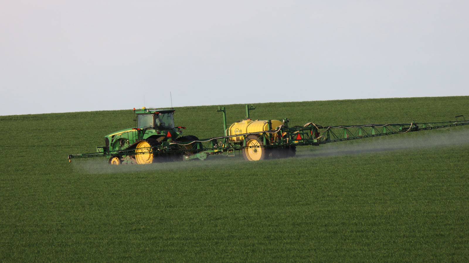 Spraying Aggressor AX herbicide